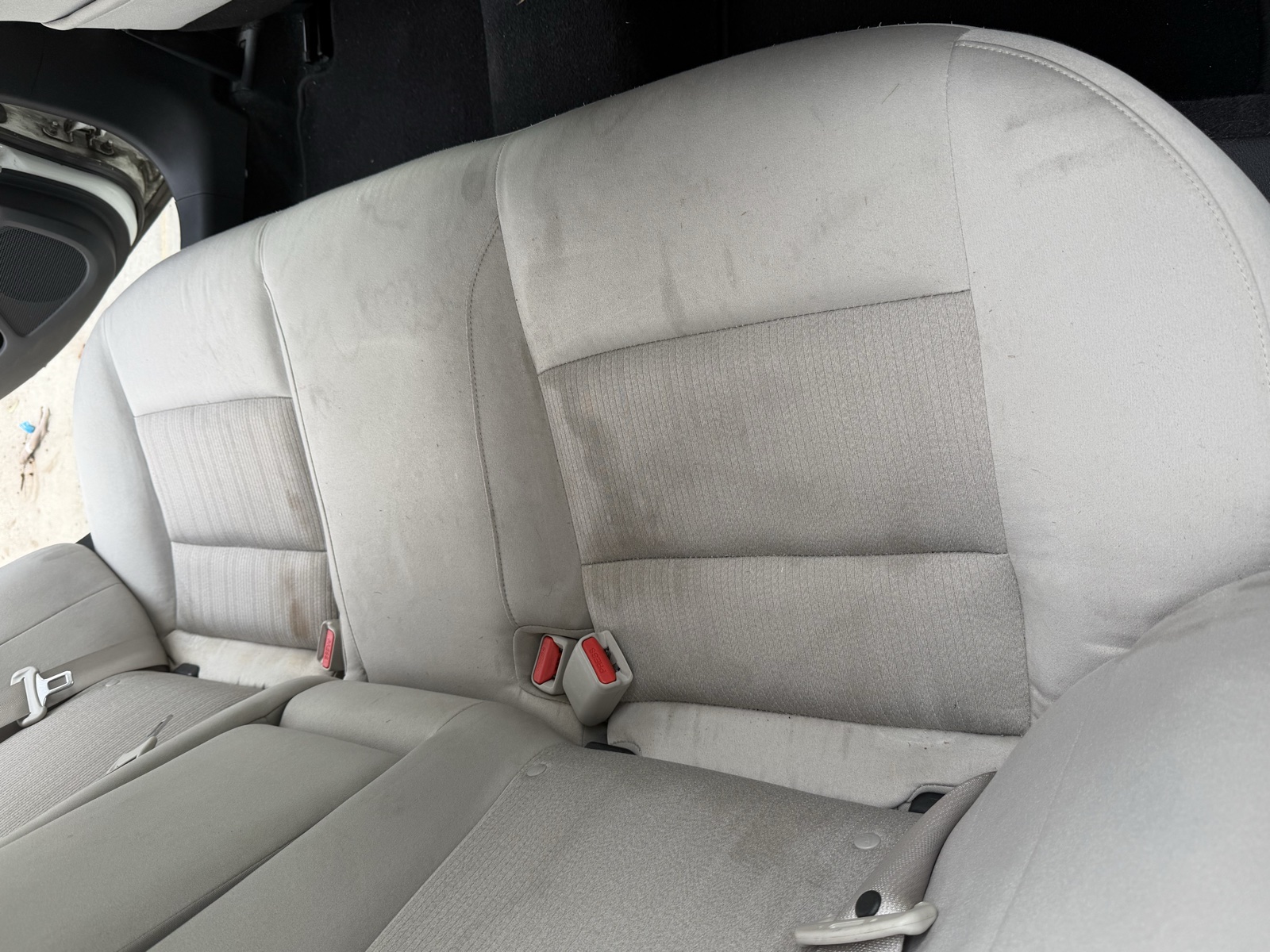Stained backseat before cleaning