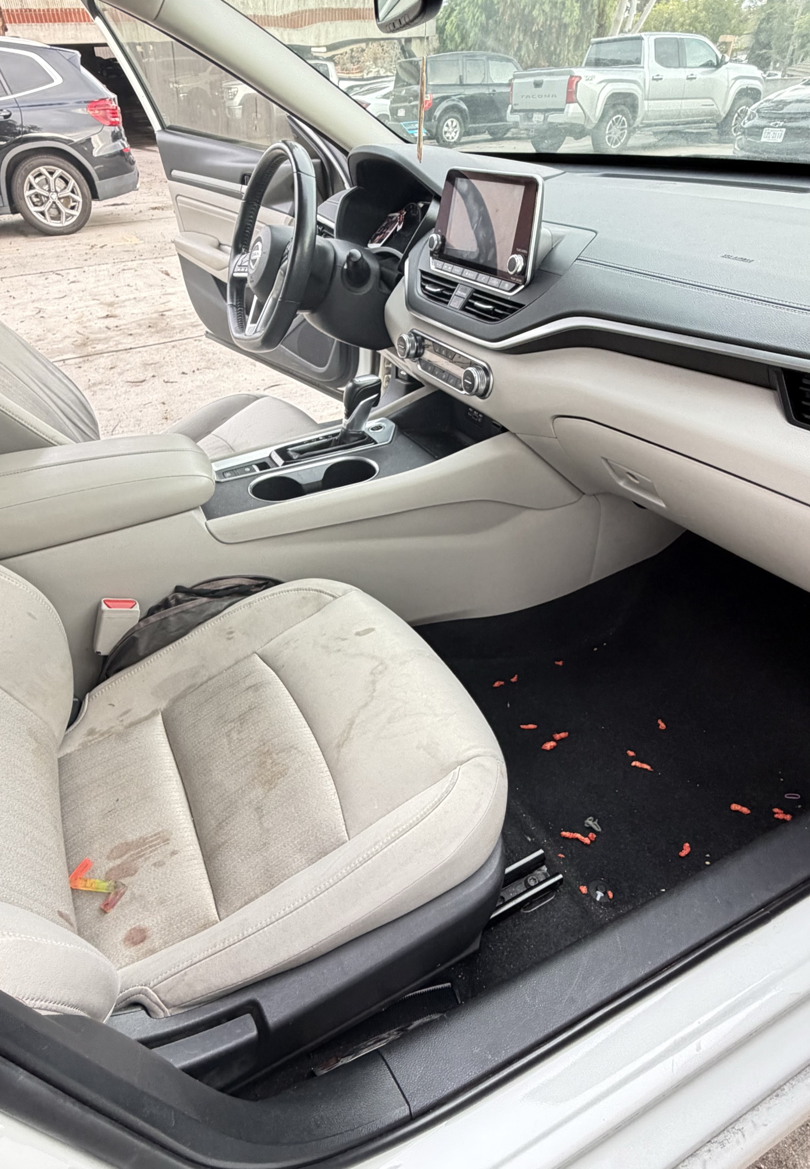 Dirty SUV interior with stains and debris